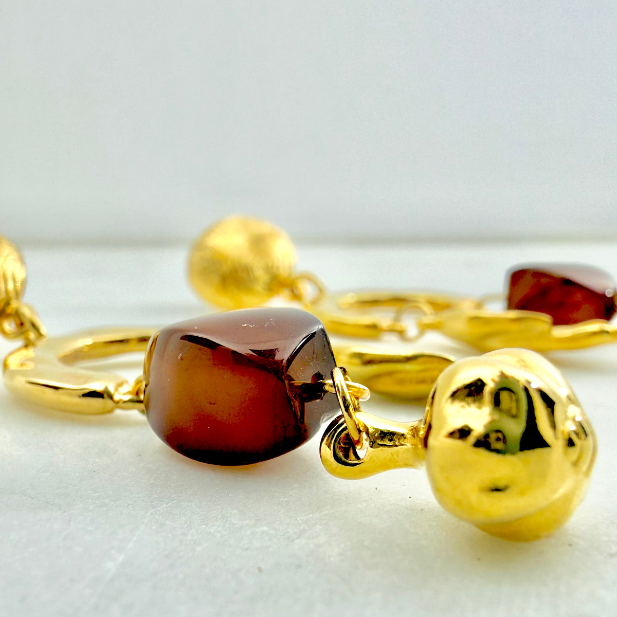 fortune earrings with gold charms and tortoiseshell bead
